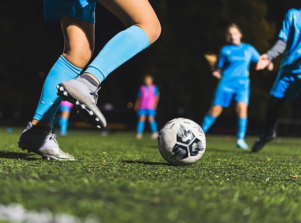 Athlete Kicking Soccer Ball