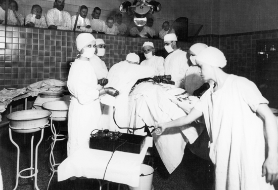 Dr. Estes performing surgery in operating room