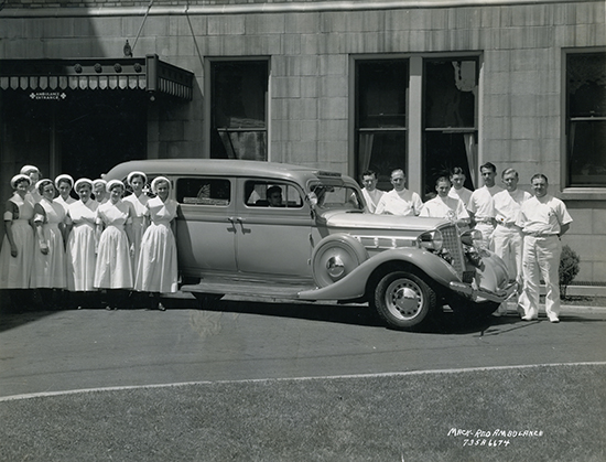 Doctors and nurses in front of ambulance