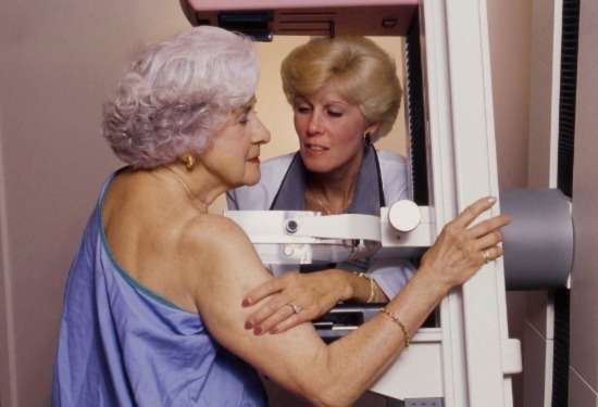 Woman getting mammogram at Breast Care Center