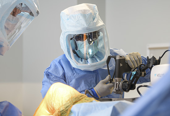 Doctor using robot in surgery