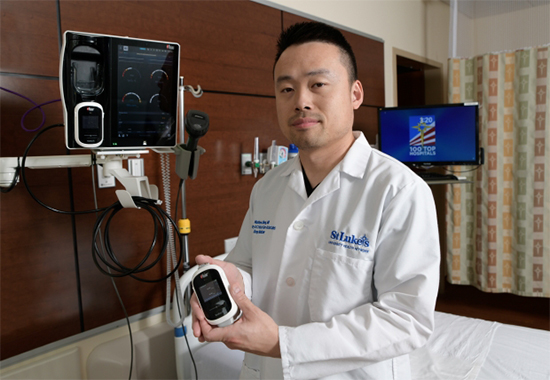 Dr. Zheng with Masimo device