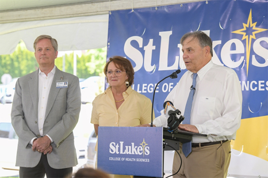 three people standing in front of a podium