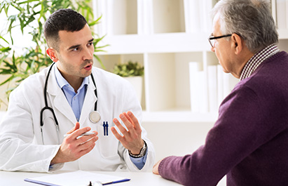 Contact - Doctor talking to a mature patient