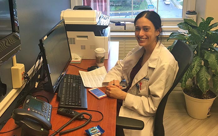 Alissa Aboff, MD, Class of 2018, enjoys her coffee before rounds begin.