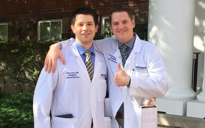 Peter Boor, MD and Nick Ferguson, MD, Class of 2017 celebrate the end of their training on a sunny, spring day.