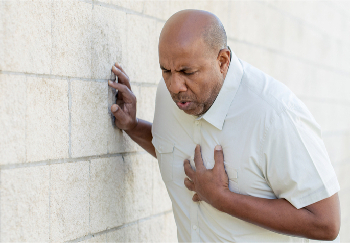older man having chest pains