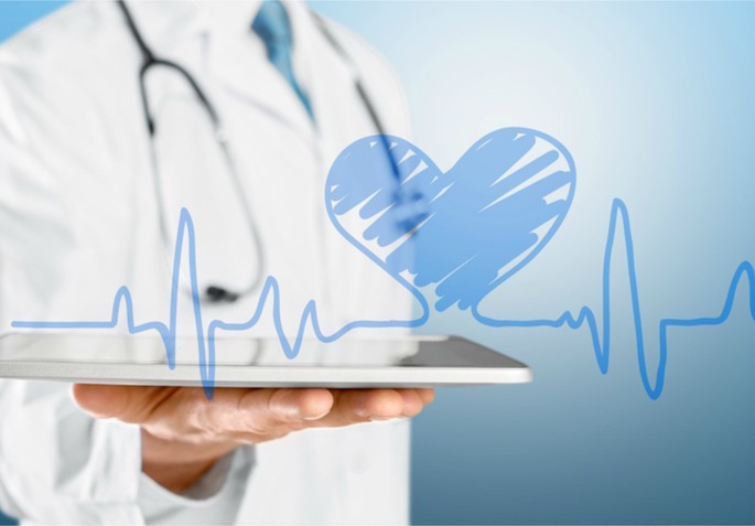 doctor holding ipad with heart beat - new romance article