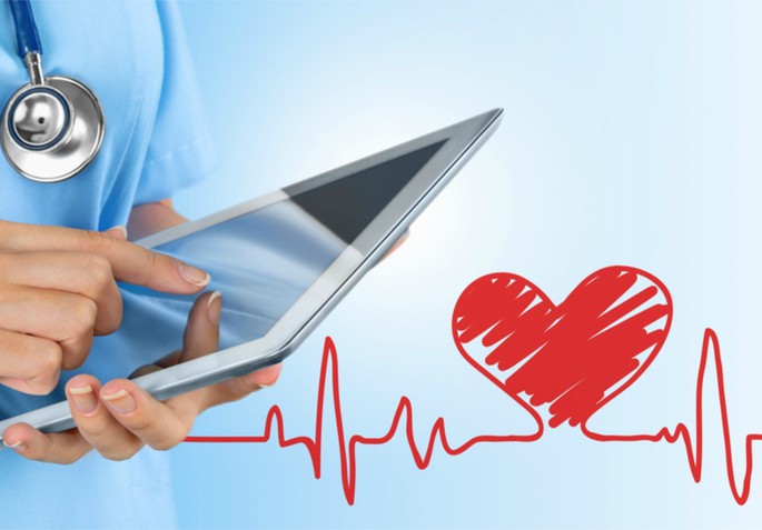 doctor holding ipad heart line