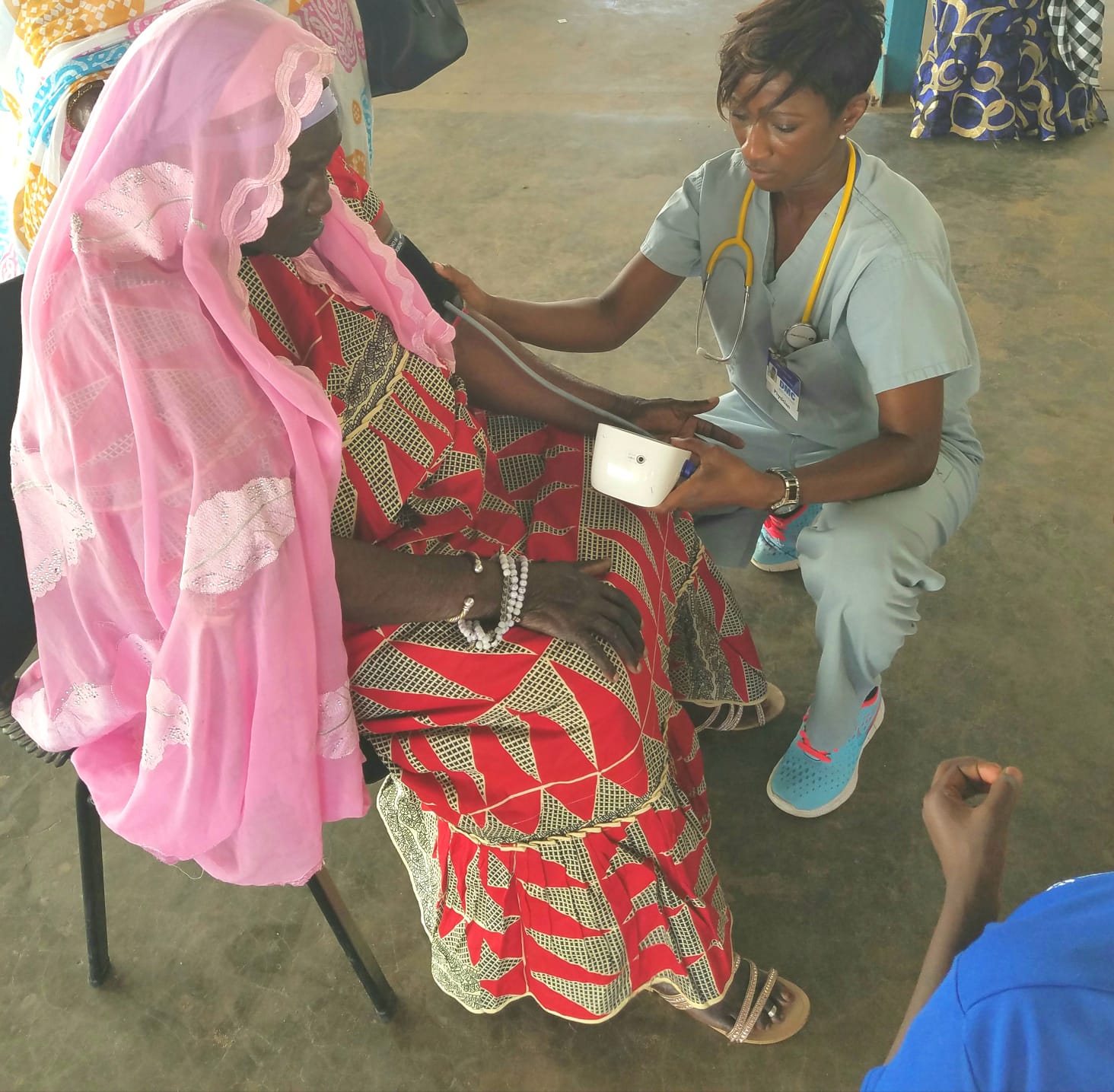 Dr. Ceesay with Gambian patient