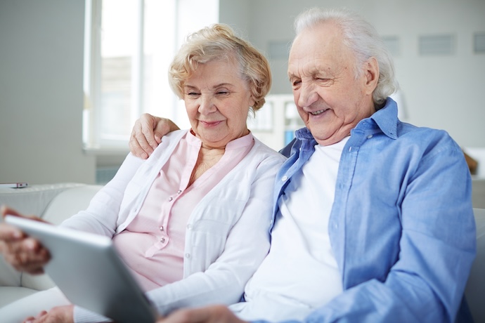 Senior couple looking over a tablet