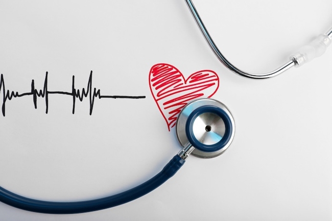 Stethoscope up against a drawing of a heart