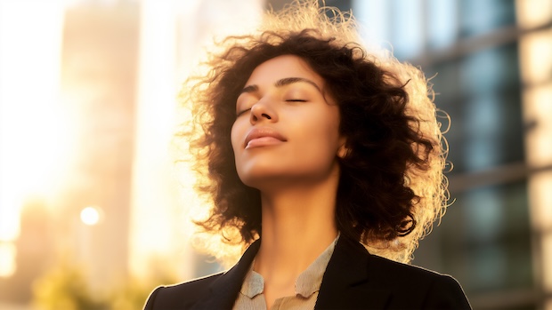 Woman enjoying the outdoors and breathing in fresh air