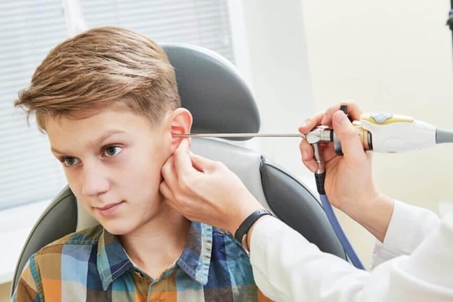 Young patient getting his ears checked