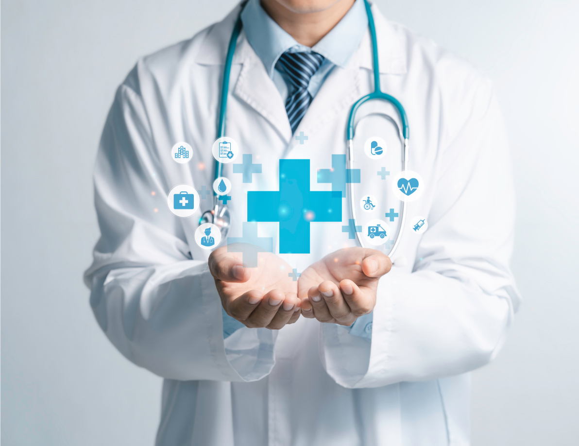 Medical professional holding out hands with medical icons floating above them