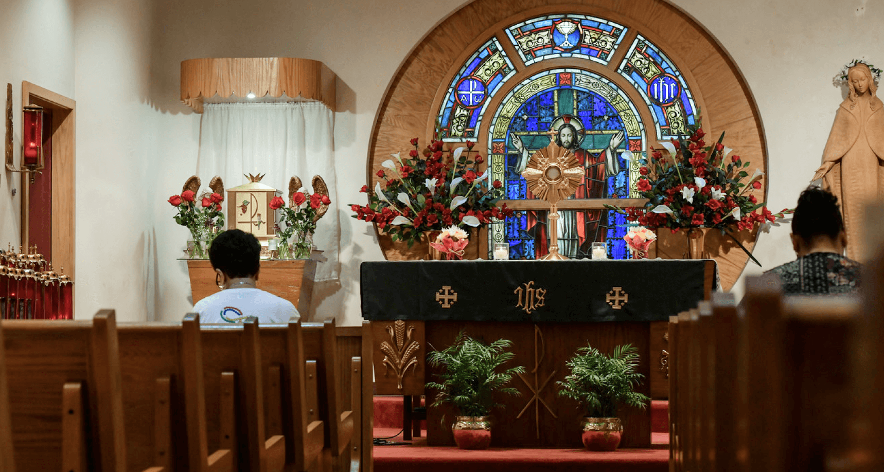 Individuals sitting inside a hospital church