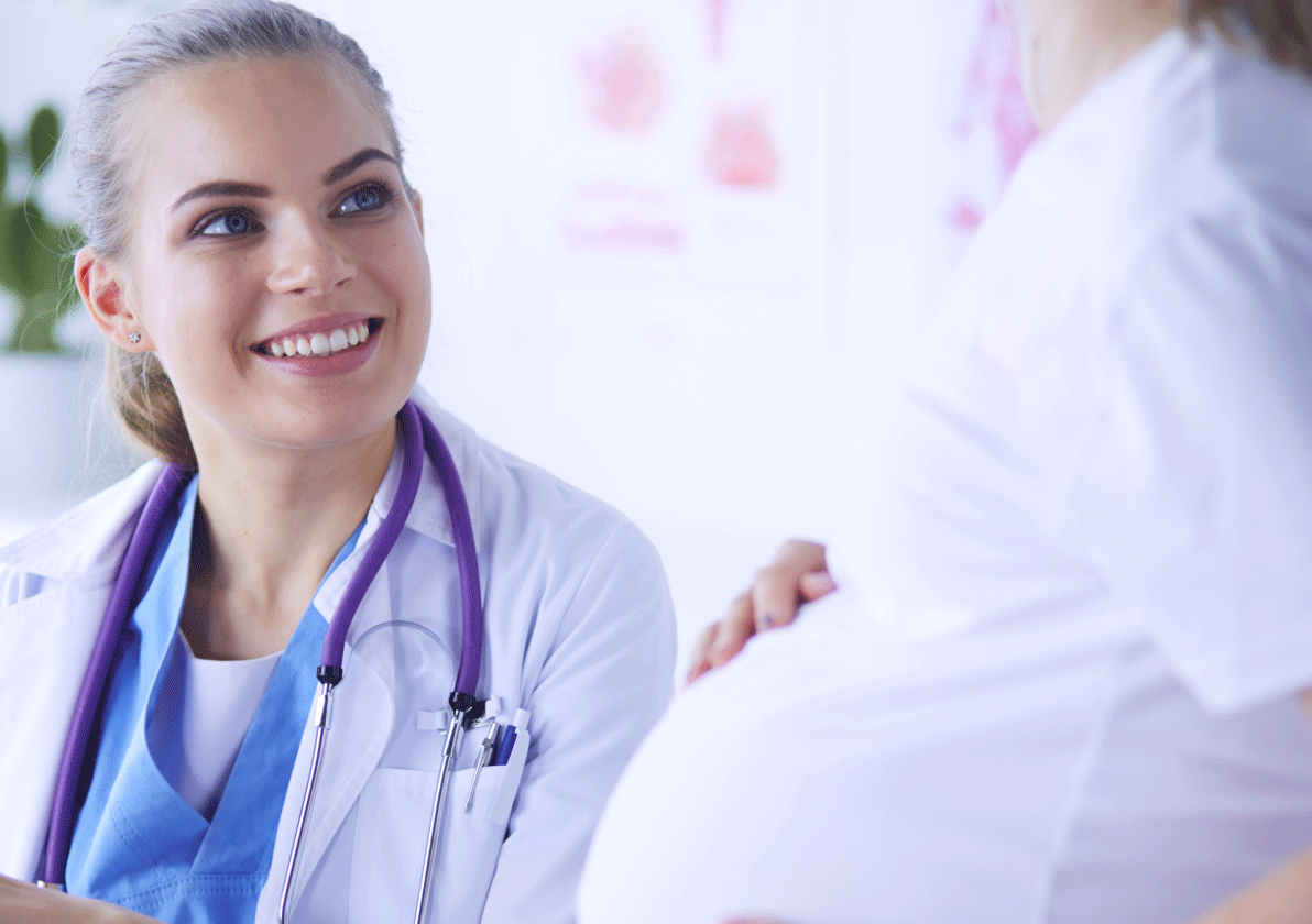 Medical professional speaking with pregnant woman