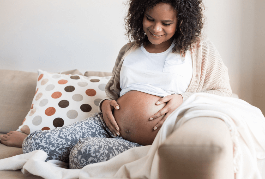 Pregnant woman holding her stomach