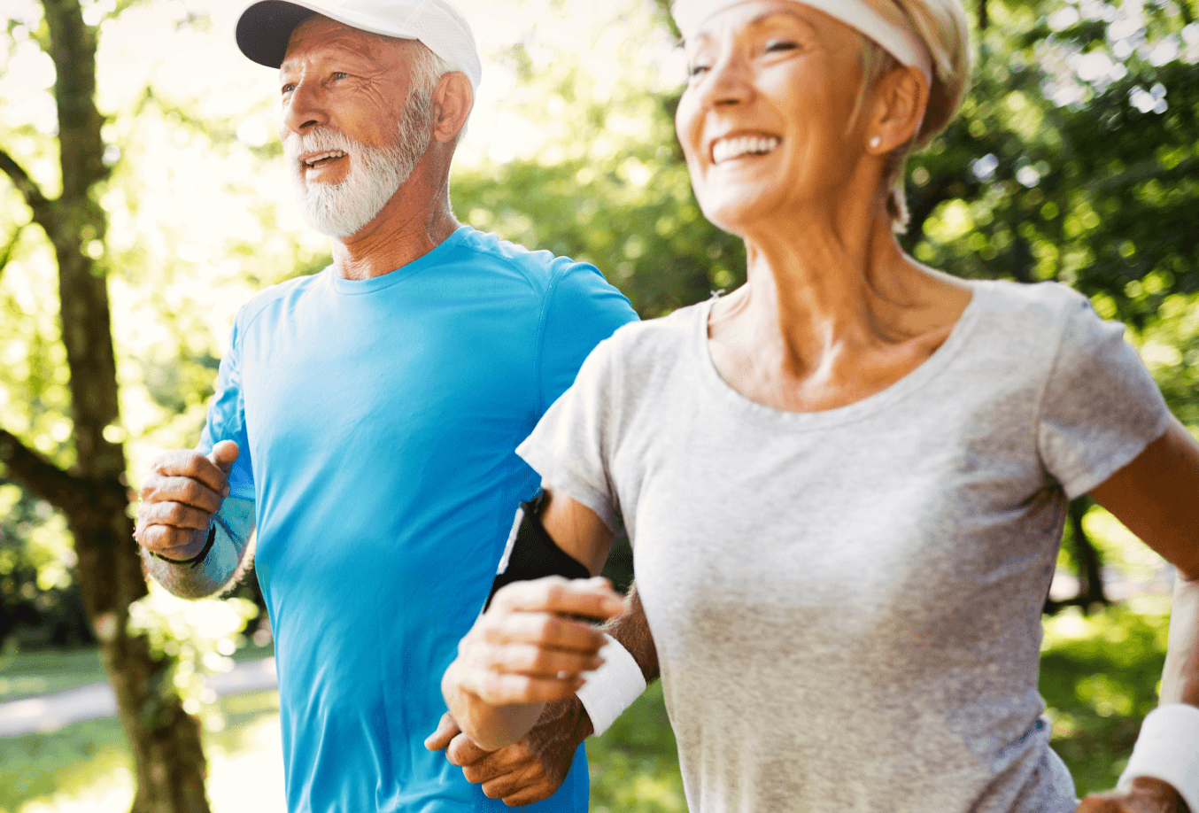 Elderly couple running on a trail