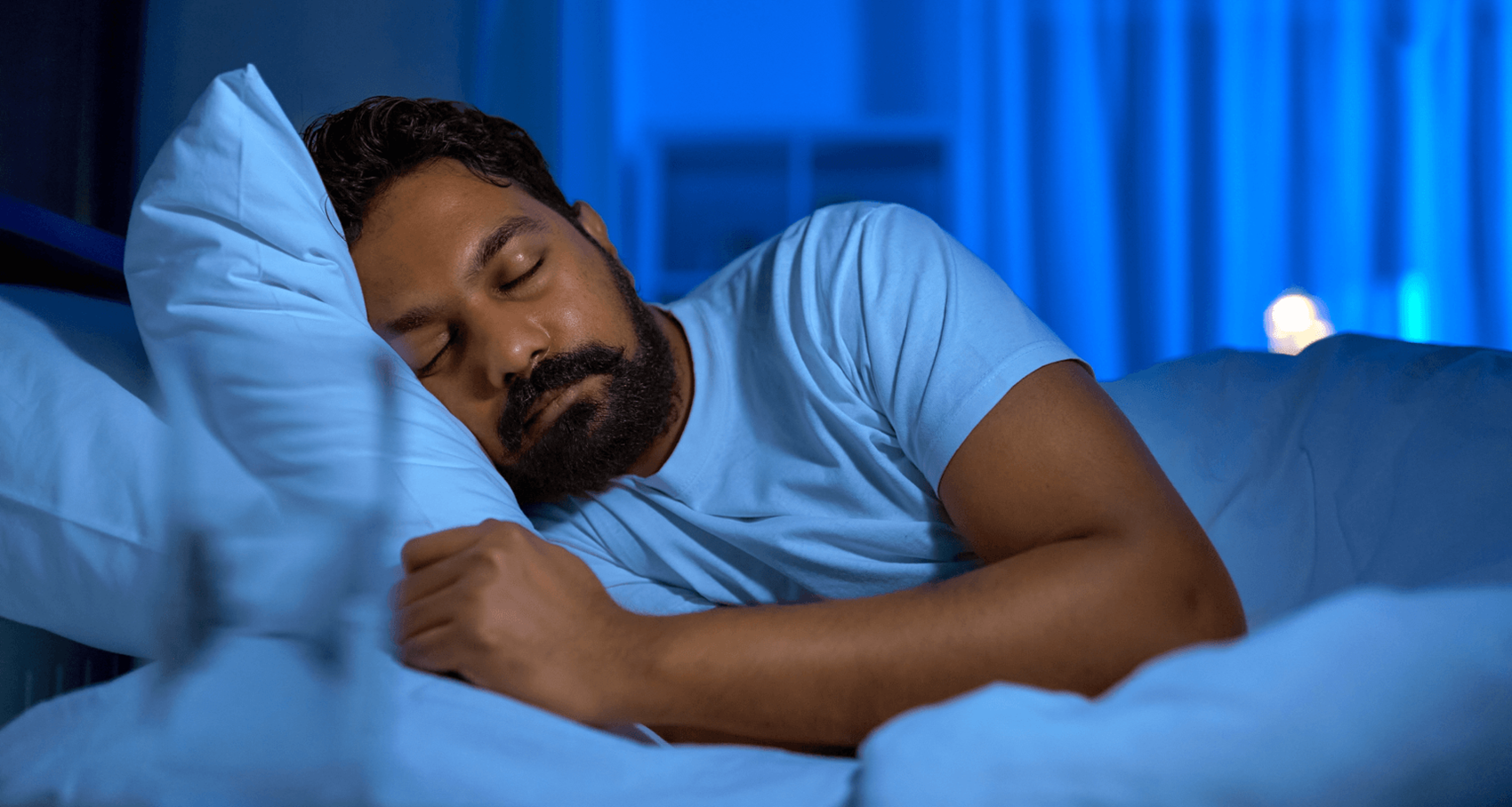 Man sleeping in his bed