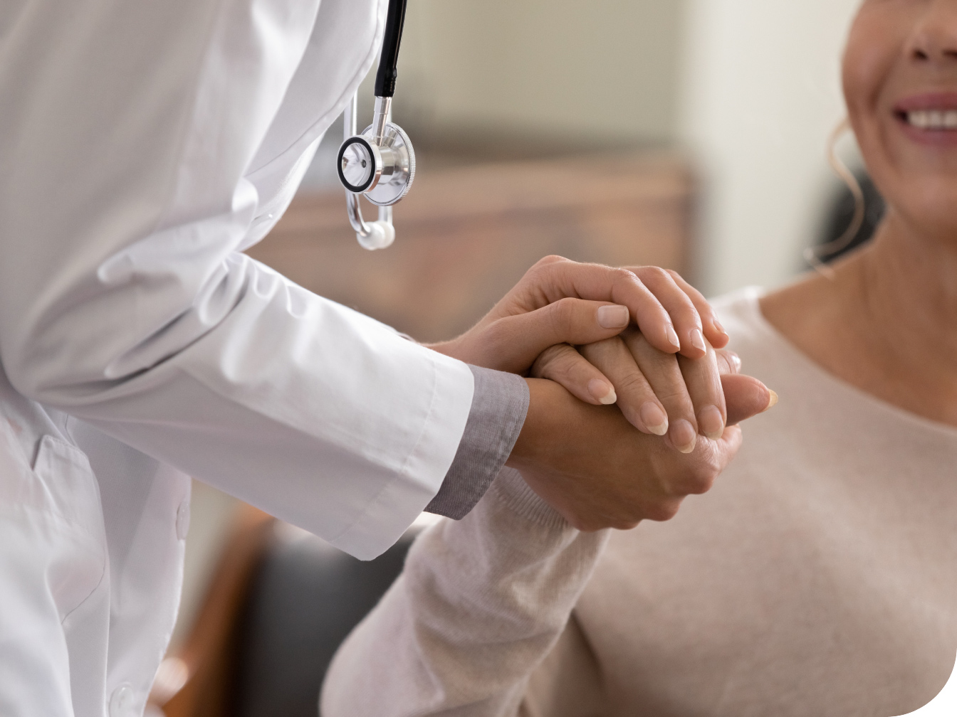 Medical Professional holding a patient's hand