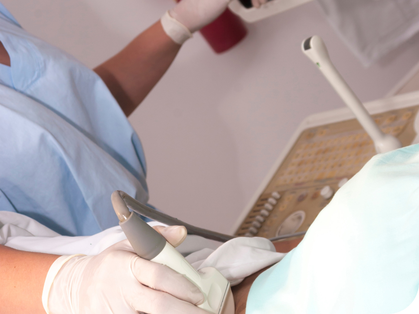 Medical Professional doing an MRI on a patient in an exam room