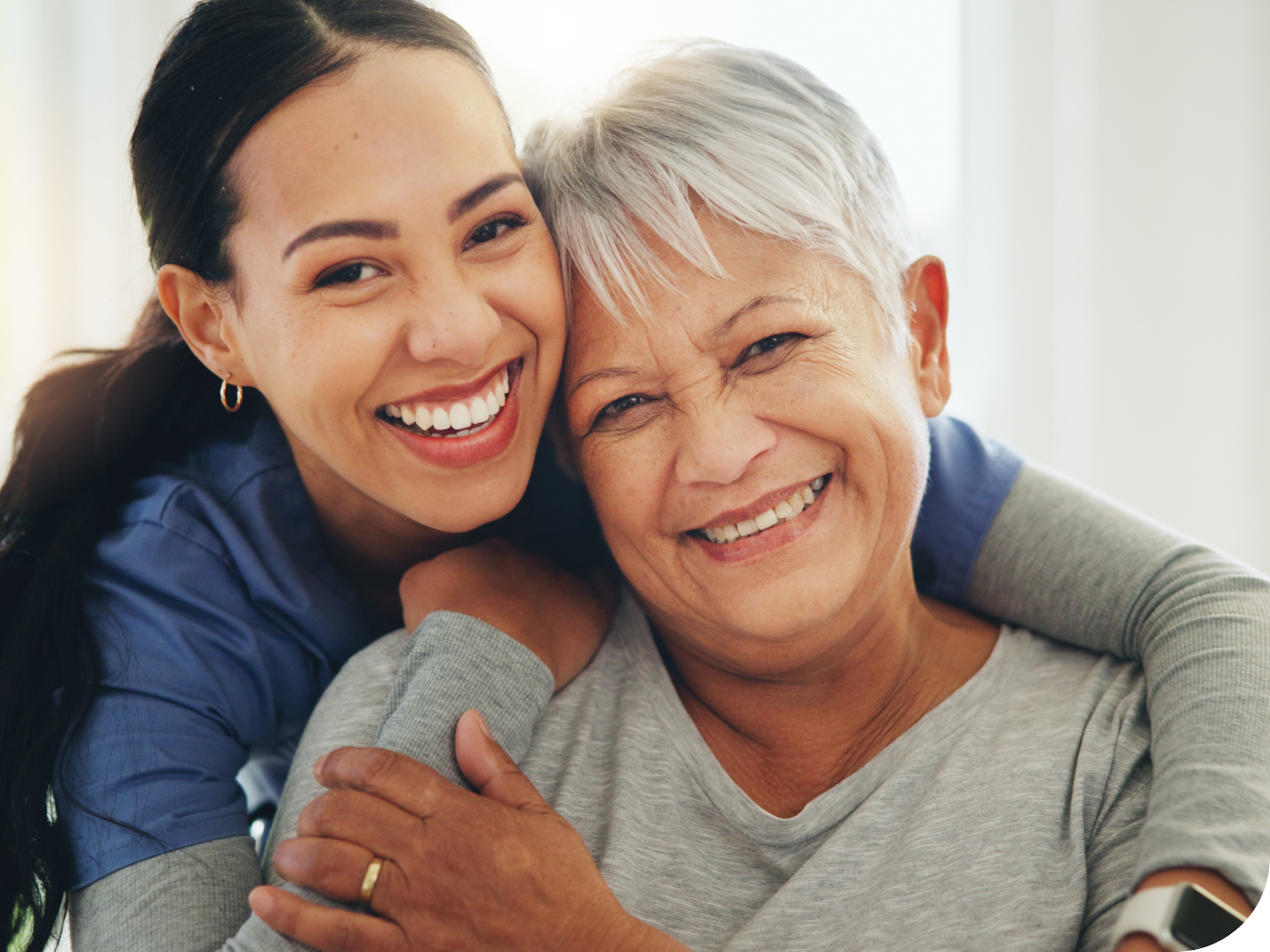 Medical Professional embracing a patient and smiling together