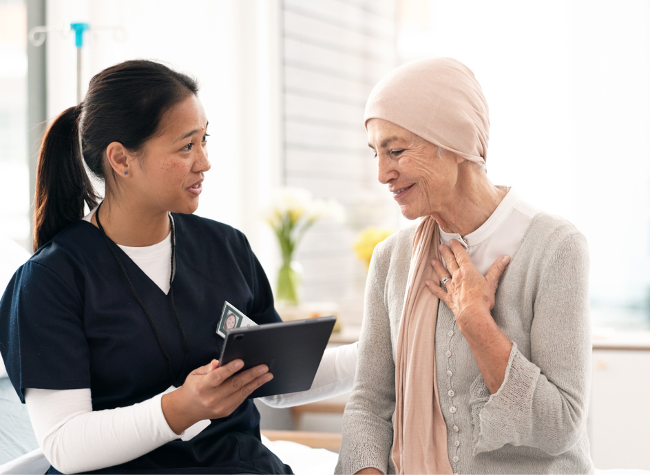 Medical Professional discussion paperwork with a cancer patient
