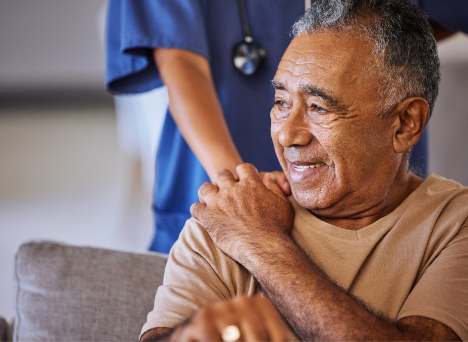 Medical Professional with hand on a patient's shoulder