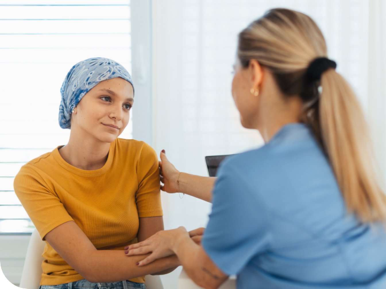 Care taker comforting a cancer patient