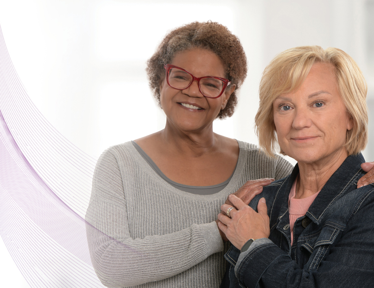 Two women embracing each other