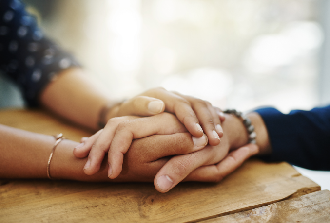 Holding patient's hand
