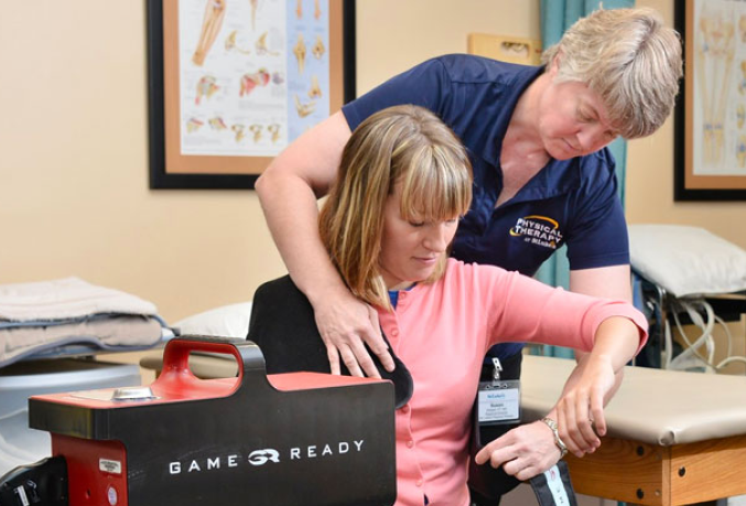 Physical Therapist helping a patient
