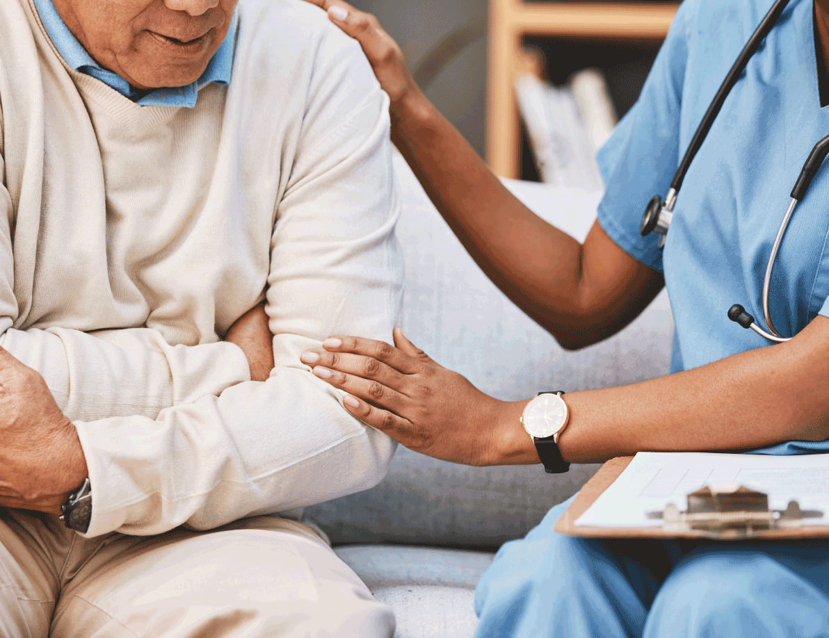 Doctor comforting an elderly patient