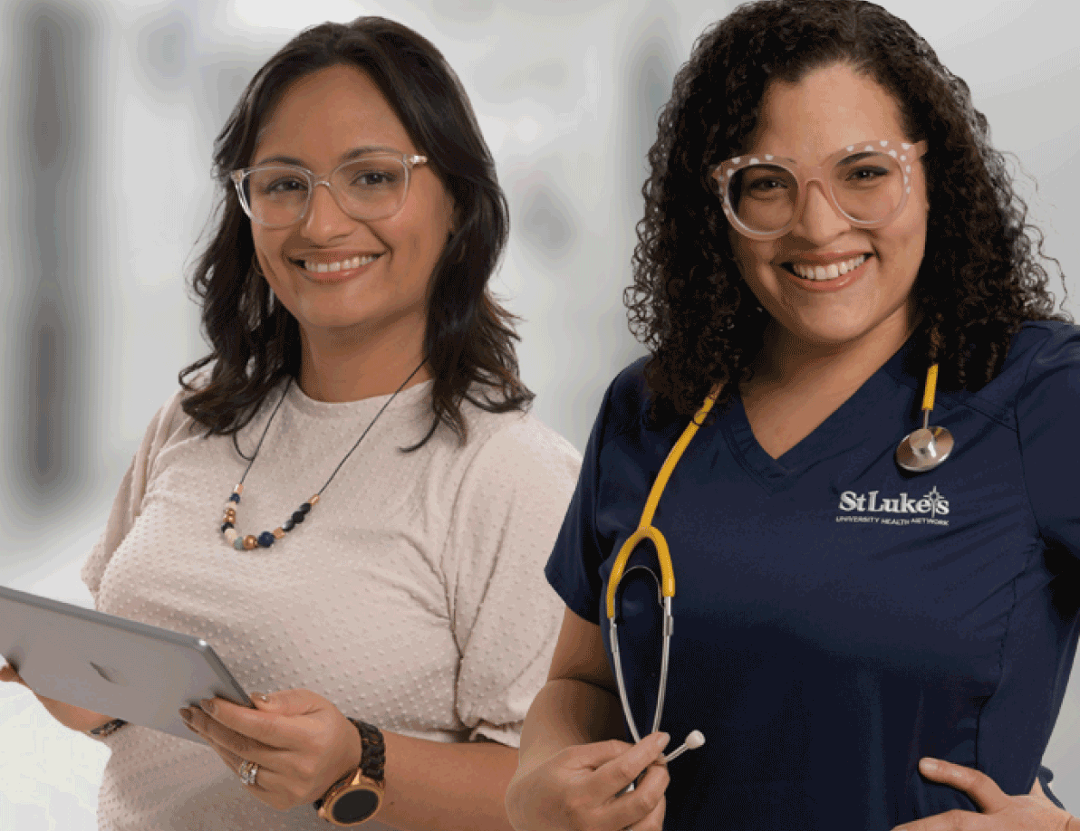 2 female employees discussing paperwork