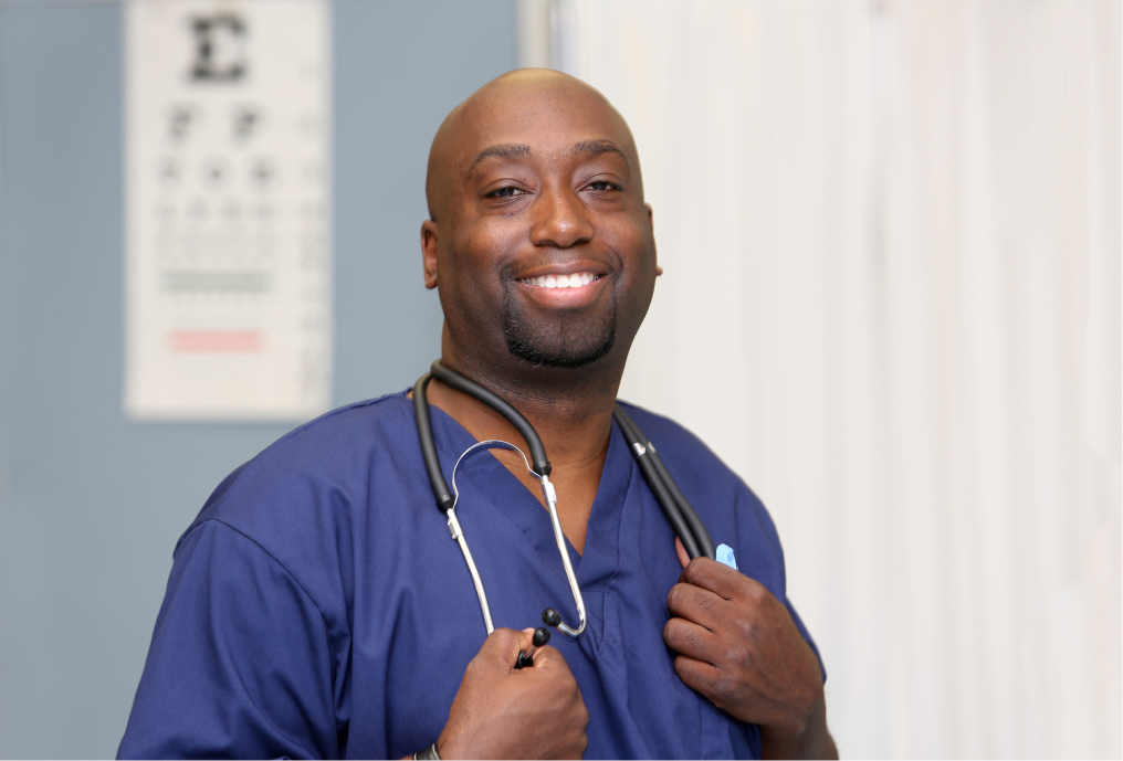 Male nurse holding stethoscope