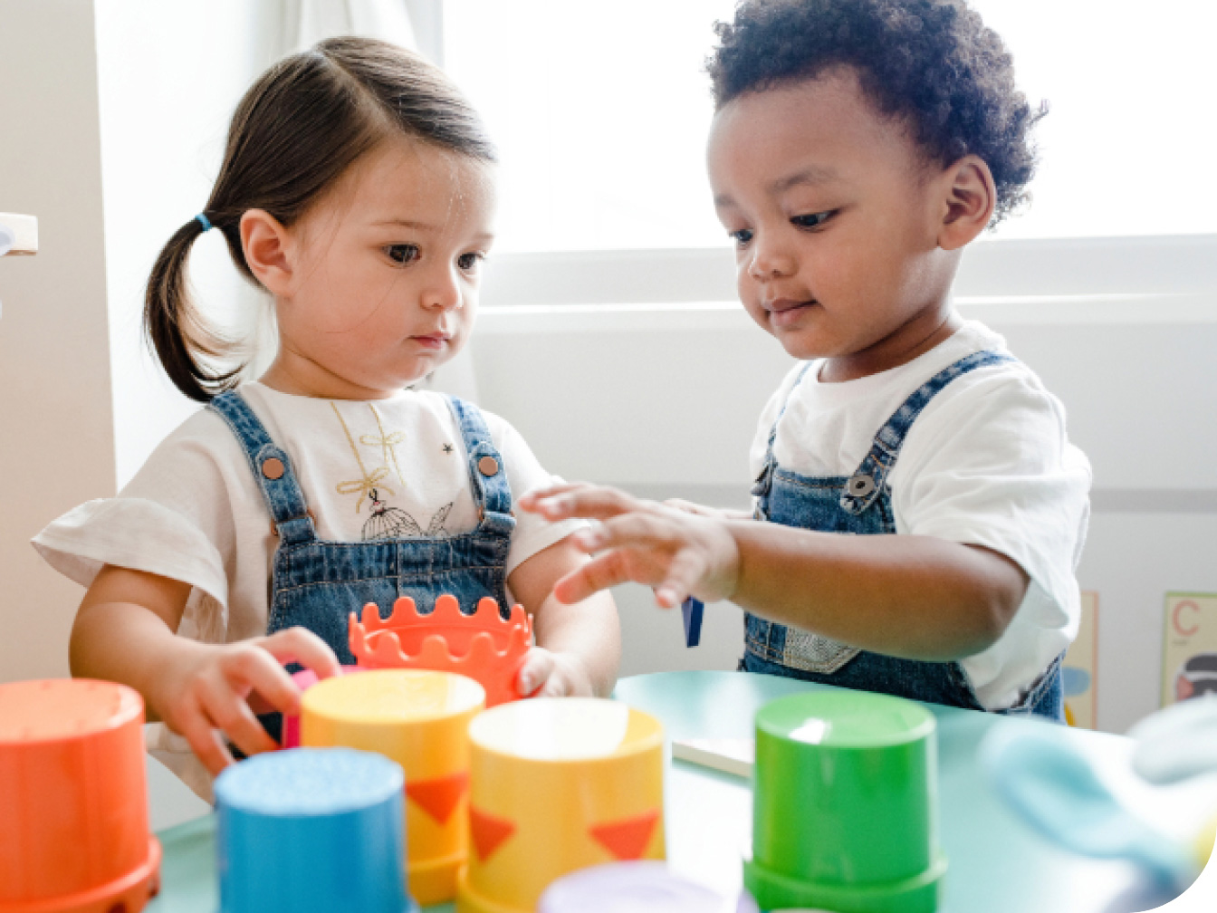 Two young toddlers playing together
