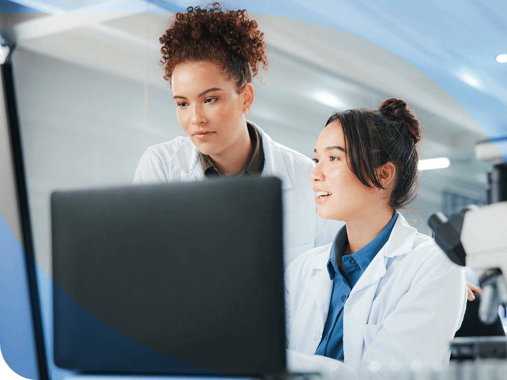 Medical professionals working on a computer