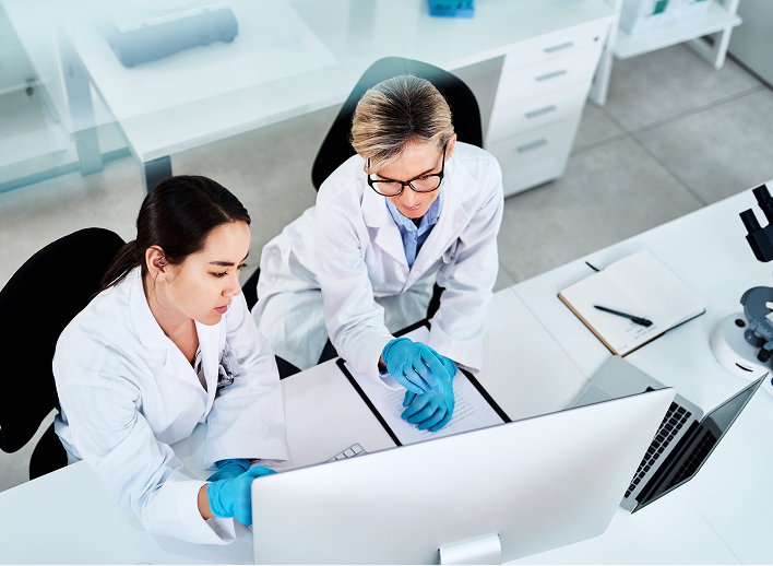 Medical professionals working on a computer