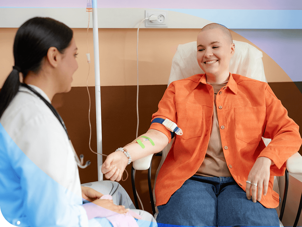 Doctor talking with a patient receiving an IV