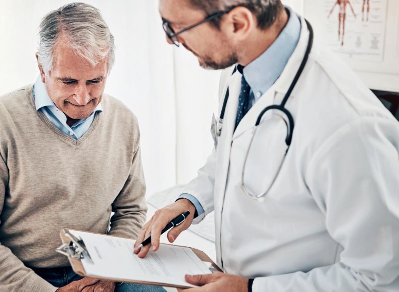 Doctor going over paper work with a patient