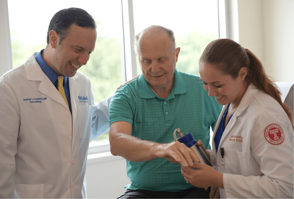 Medical Professional looking at patient's skin