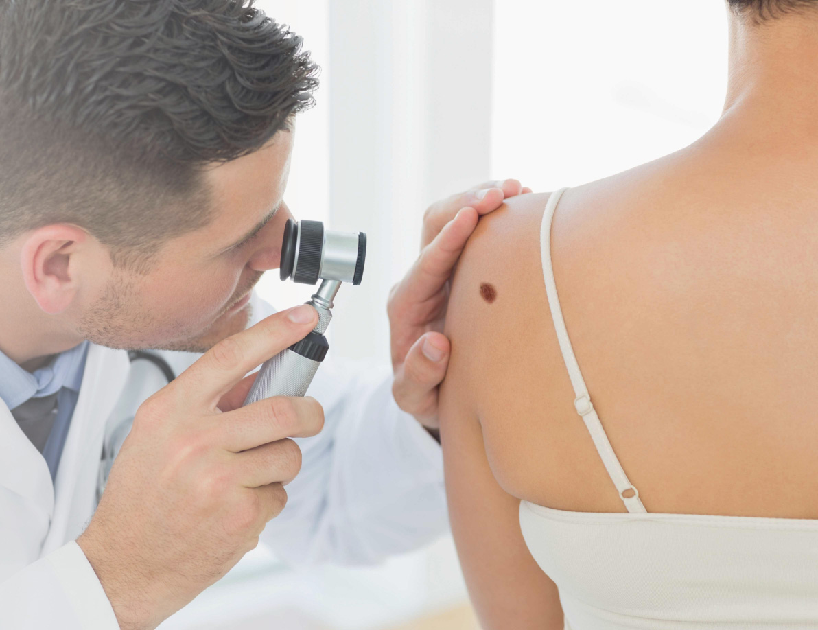 Doctor looking at patient's skin