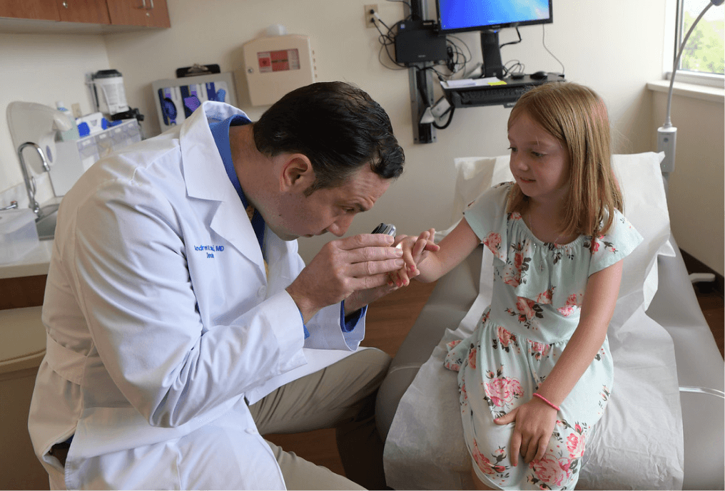 Doctor looking at patient's skin