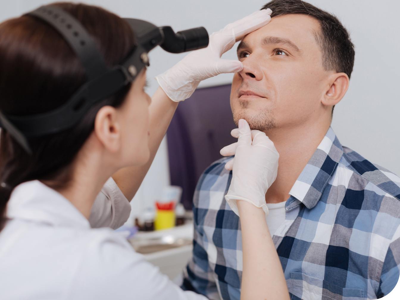 Medical professional evaluating a patient