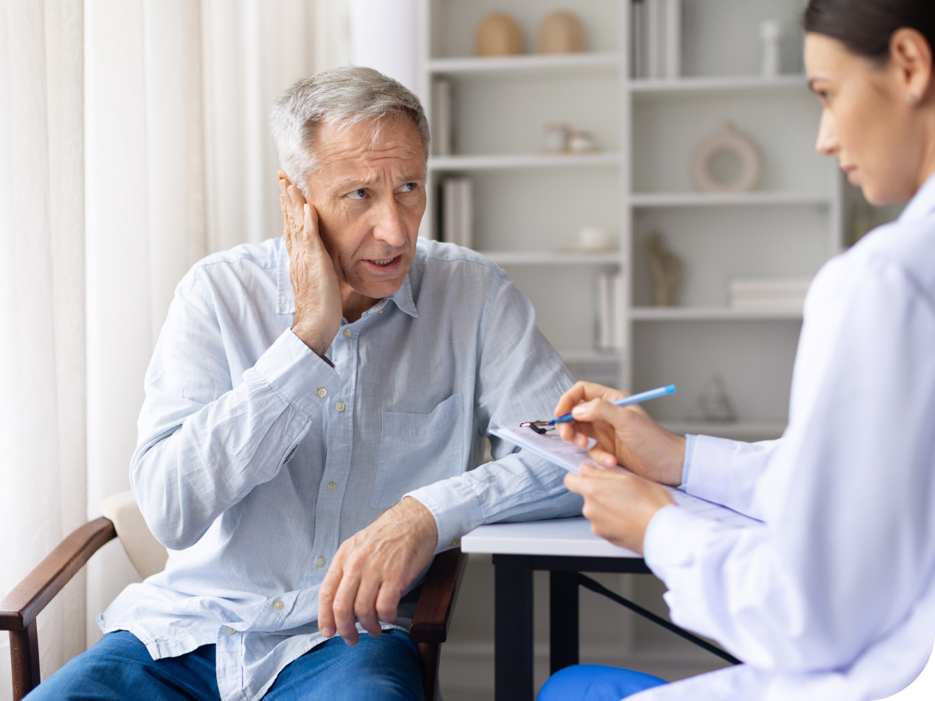 Medical professional talking with a patient
