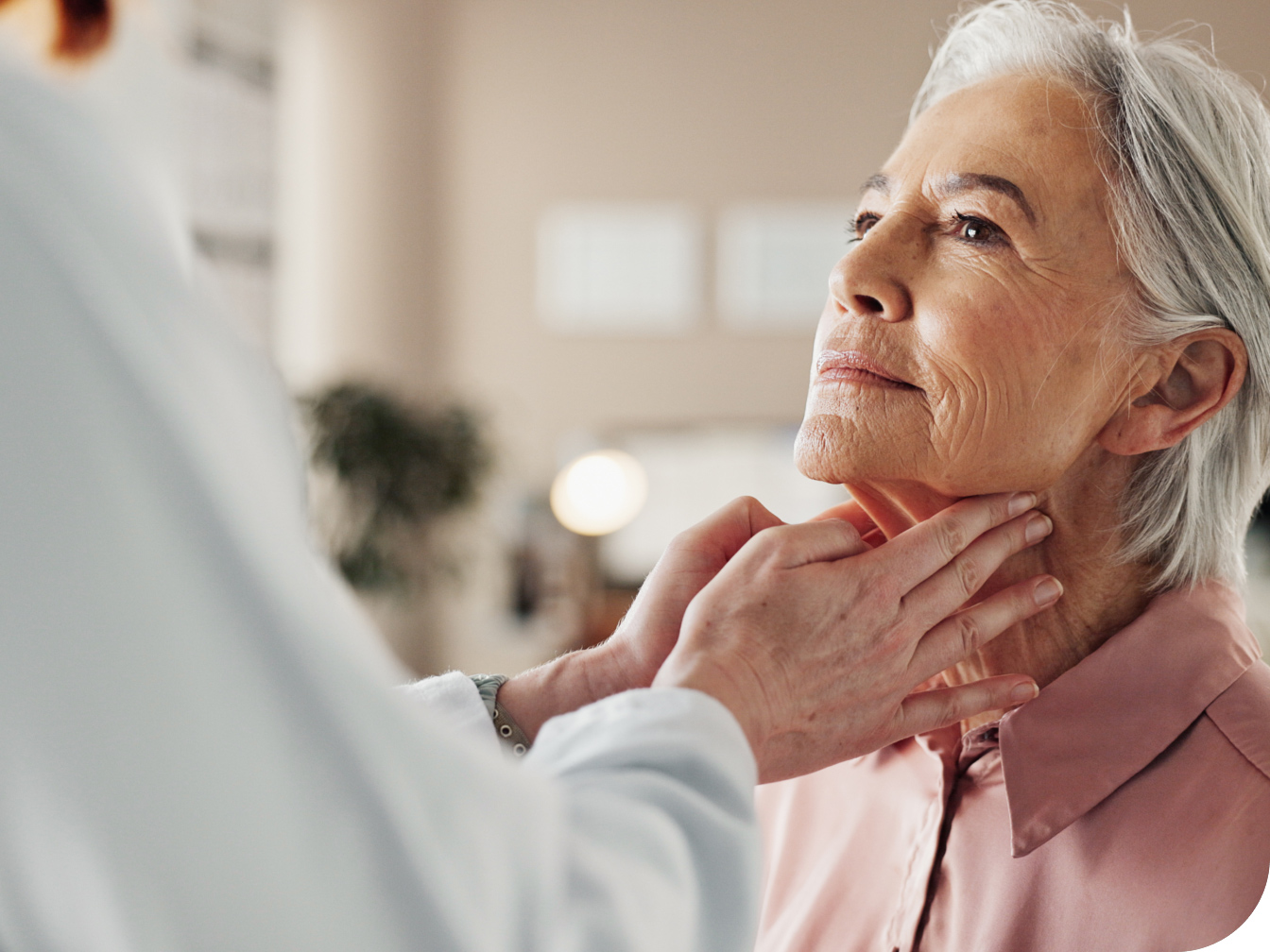 Medical professional evaluating a patient's throat