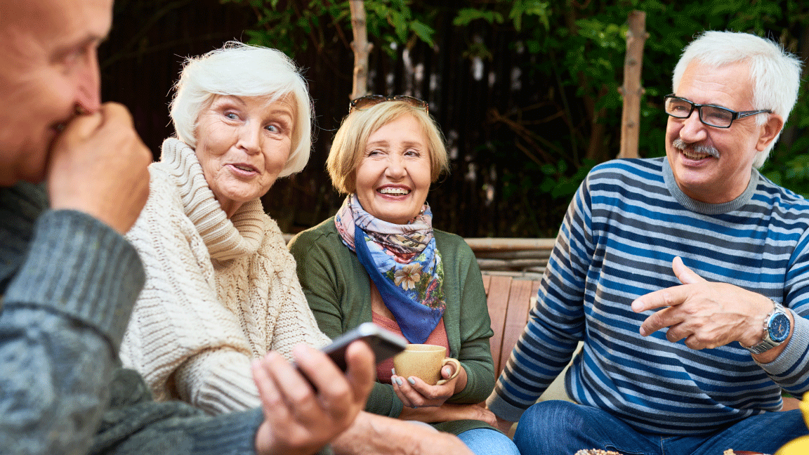 Group of older adults chatting outdoors
