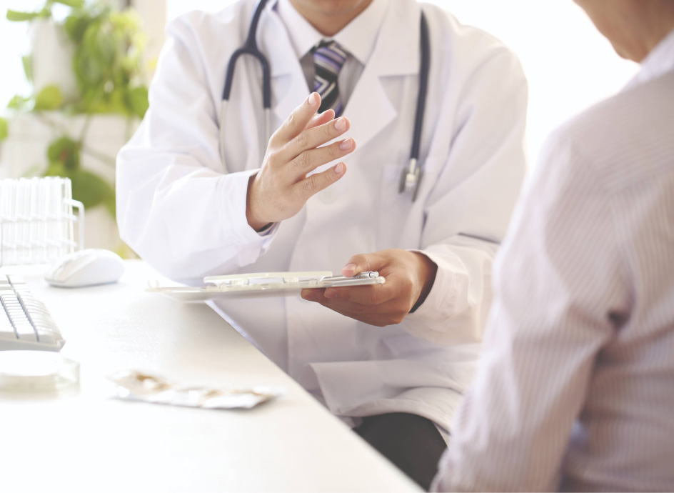 Medical professional talking with a patient