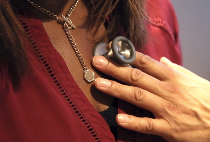 Medial professional listening to a patient's chest